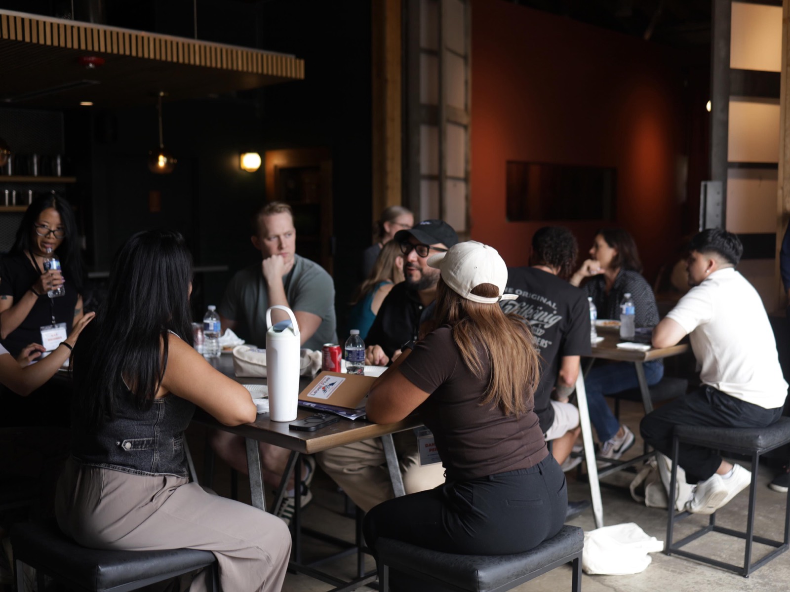 Mobile business owners comparing notes around a table at Level Five Live